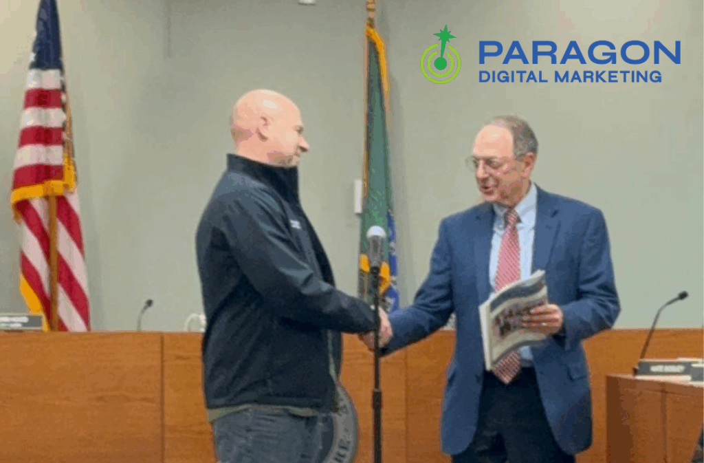 Zach Luse accepting recognition from the mayor of Keene