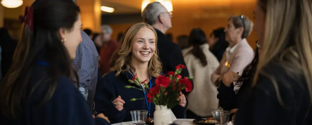 Students celebrating Voice Z's 100th Client